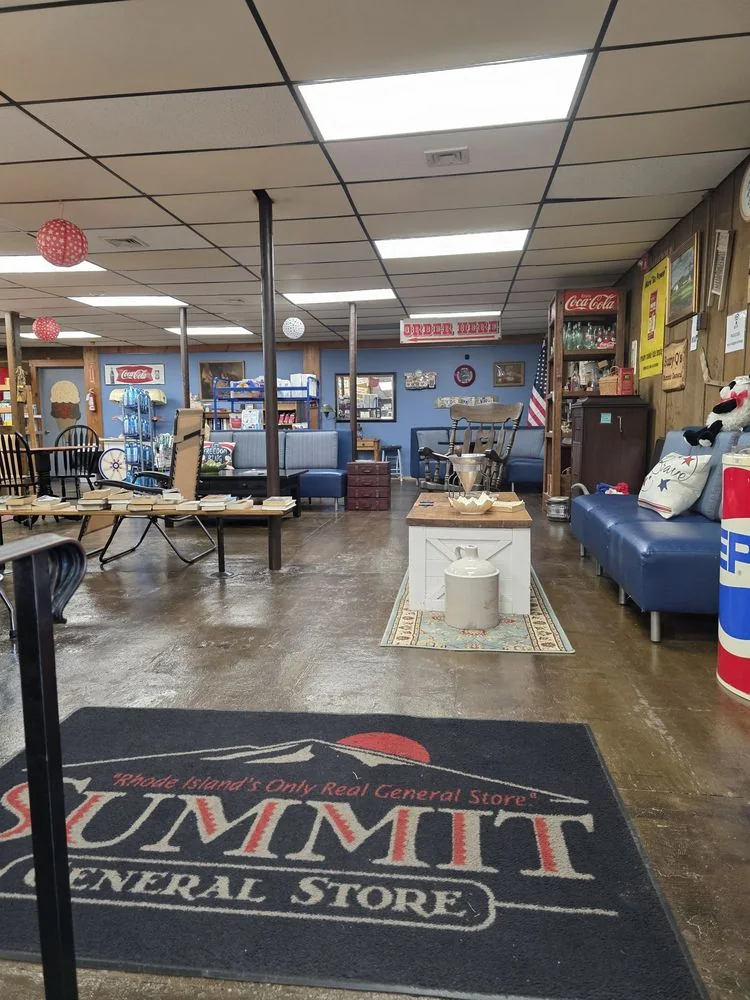 Inside the store: the Summit General Store rug, wood counters and a blue booth